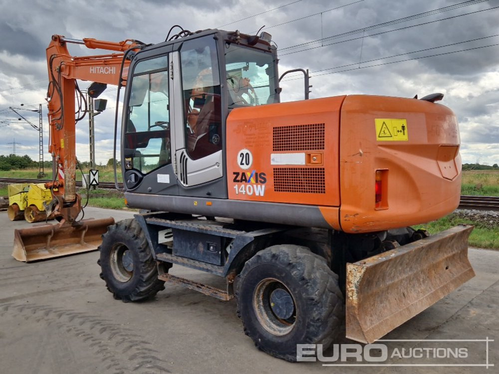 2010 Hitachi ZX140W-3 - Pelle sur pneus: photos 3 2010 Hitachi ZX140W-3 - Pelle sur pneus: photos 3