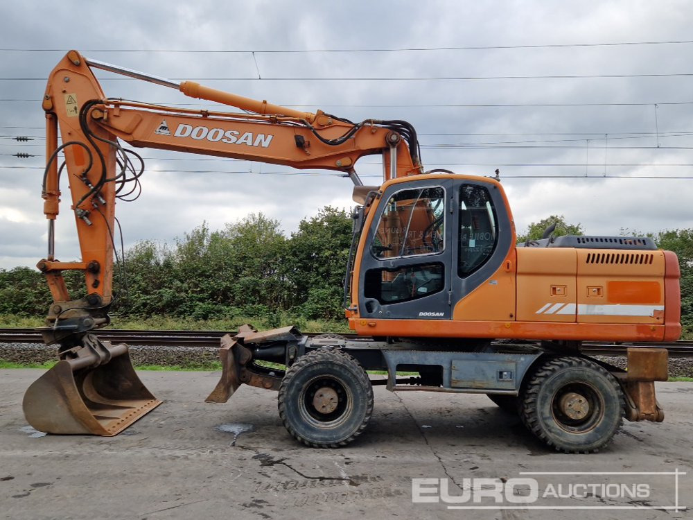 Doosan DX210W - Pelle sur pneus: photos 2 Doosan DX210W - Pelle sur pneus: photos 2