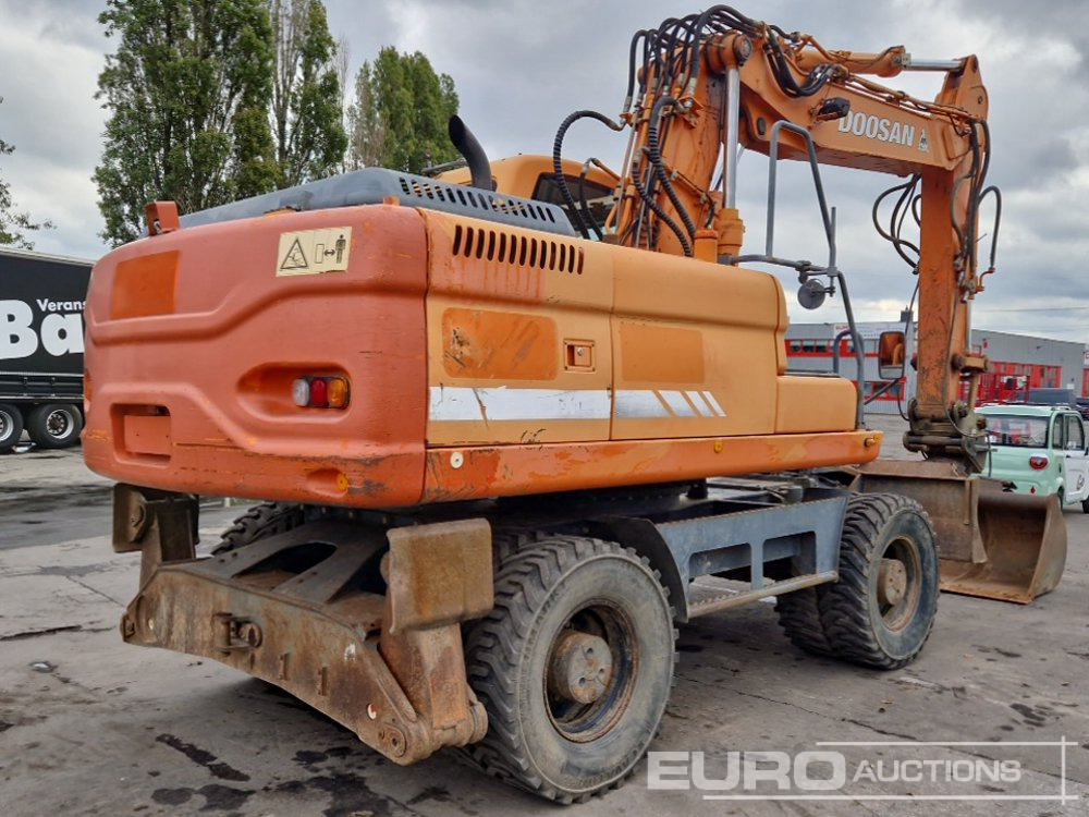 Doosan DX210W - Pelle sur pneus: photos 5 Doosan DX210W - Pelle sur pneus: photos 5