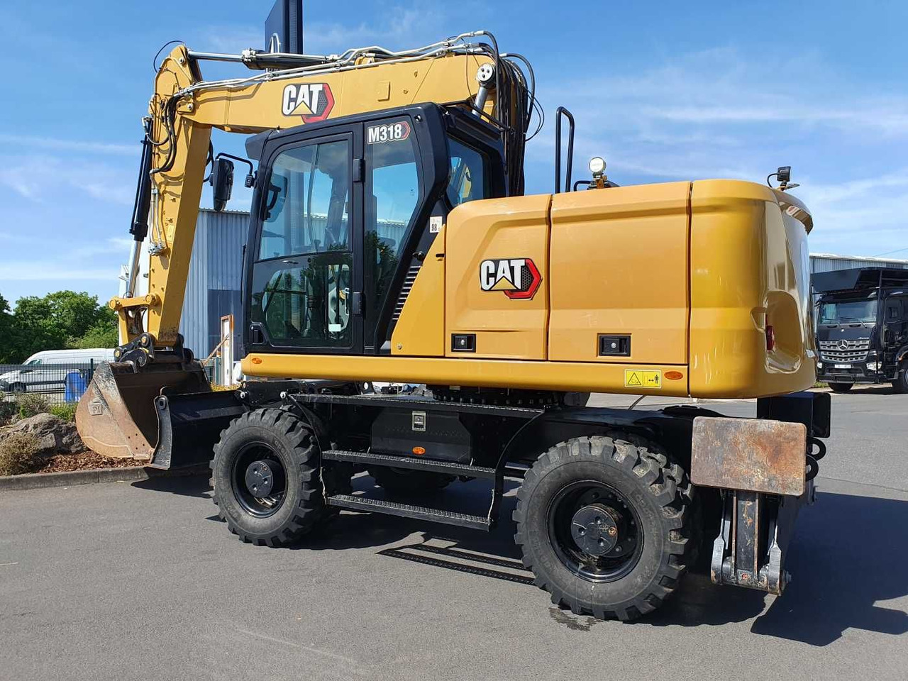 CAT M318 / 2022 / nur 286h! / Tieflöffel / Pratzen - Pelle sur pneus: photos 3 CAT M318 / 2022 / nur 286h! / Tieflöffel / Pratzen - Pelle sur pneus: photos 3