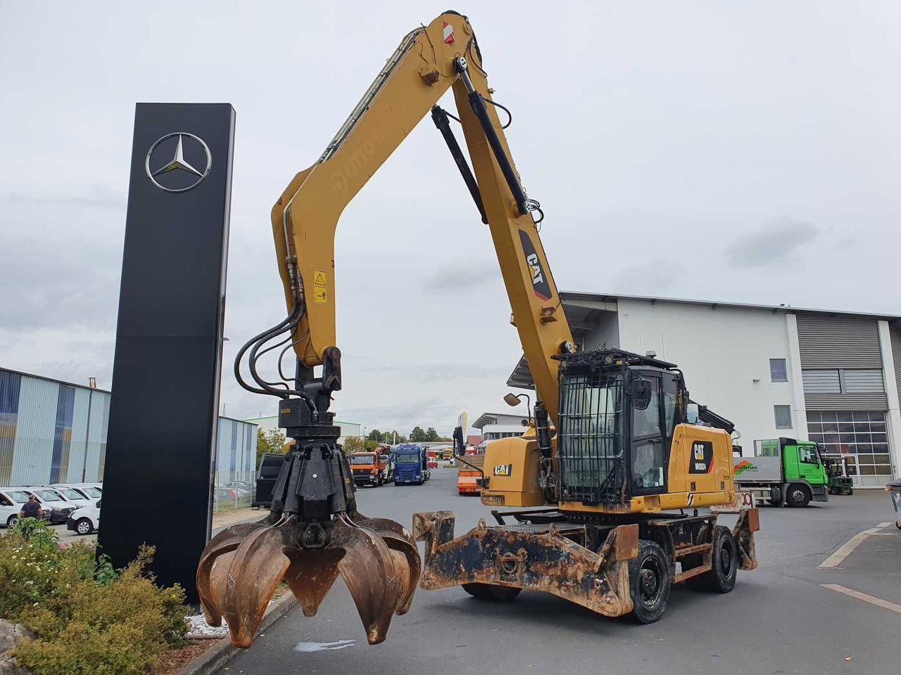 CAT MH3024 / MH 3024 / Greifer / 2018 / 9.424h - Pelle sur pneus: photos 1 CAT MH3024 / MH 3024 / Greifer / 2018 / 9.424h - Pelle sur pneus: photos 1