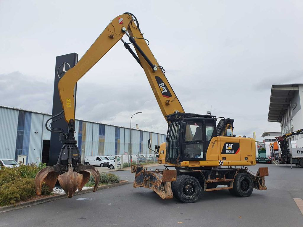 CAT MH3024 / MH 3024 / inkl. Greifer / 2018 / 9.424h - Pelle sur pneus: photos 2 CAT MH3024 / MH 3024 / inkl. Greifer / 2018 / 9.424h - Pelle sur pneus: photos 2