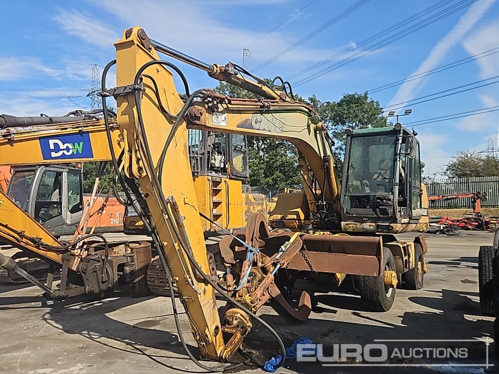 Case WX170 - Pelle sur pneus: photos 1 Case WX170 - Pelle sur pneus: photos 1