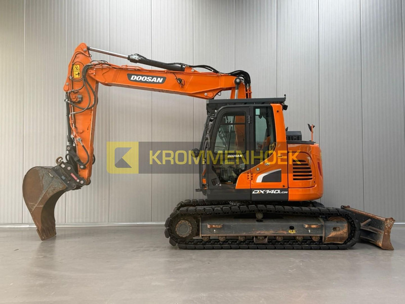 Doosan DX 140 LCR-5 Oilquick - Pelle sur chenille: photos 1 Doosan DX 140 LCR-5 Oilquick - Pelle sur chenille: photos 1