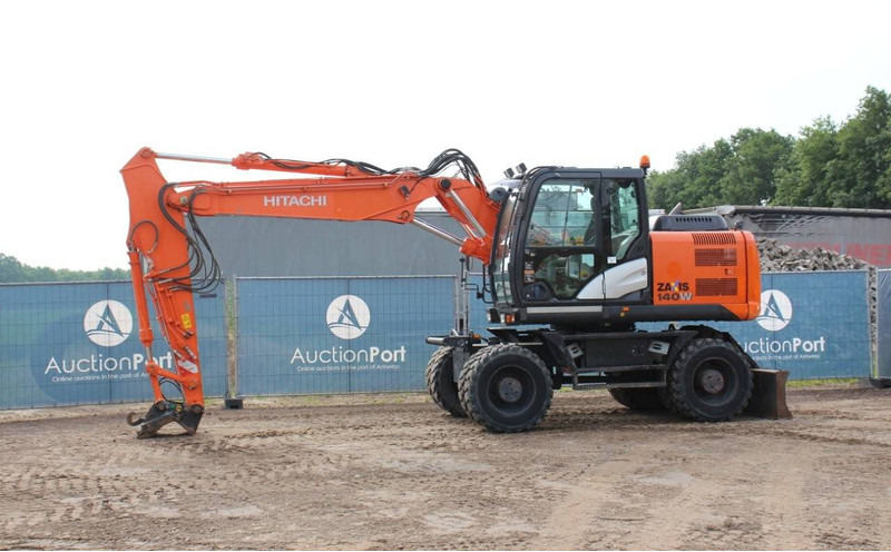 Hitachi ZX140W-5B - Pelle sur pneus: photos 1 Hitachi ZX140W-5B - Pelle sur pneus: photos 1