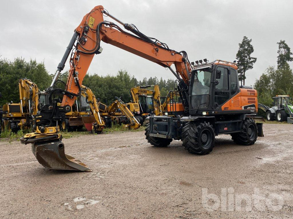 Doosan DX 140W - Pelle sur pneus: photos 2 Doosan DX 140W - Pelle sur pneus: photos 2