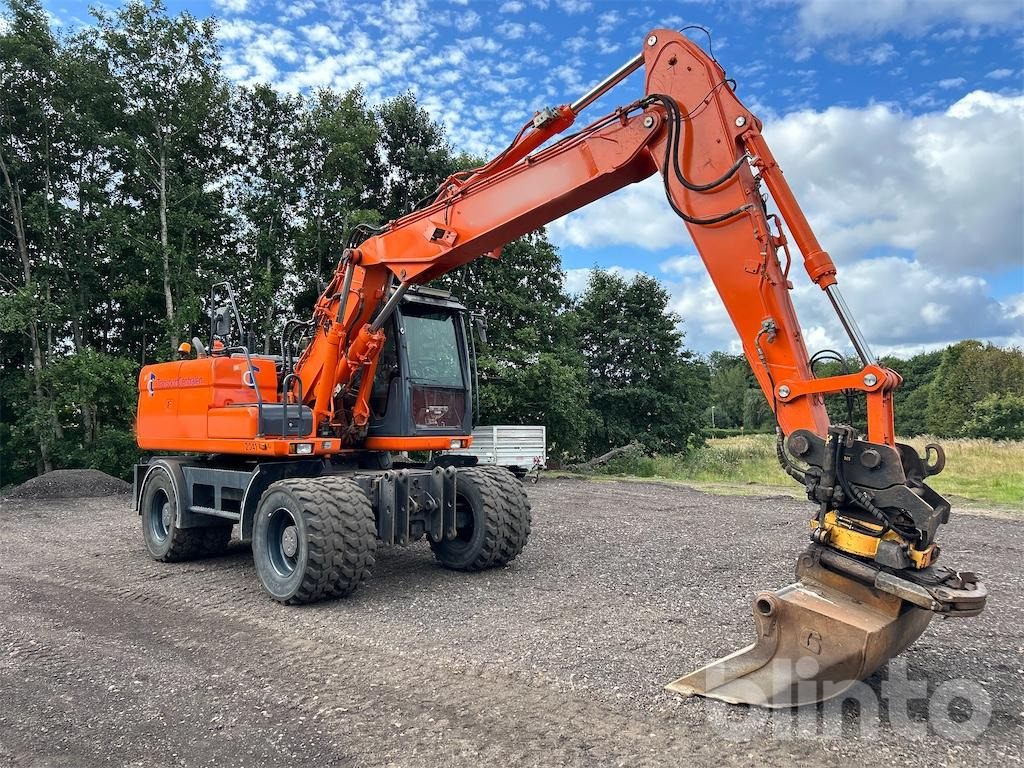 Doosan DX160W - Pelle sur pneus: photos 4 Doosan DX160W - Pelle sur pneus: photos 4