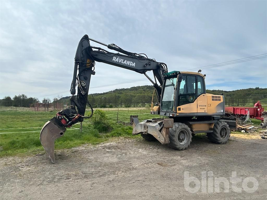 Volvo EW140 - Pelle sur pneus: photos 1 Volvo EW140 - Pelle sur pneus: photos 1